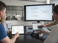 Team sketching a technical flow on paper